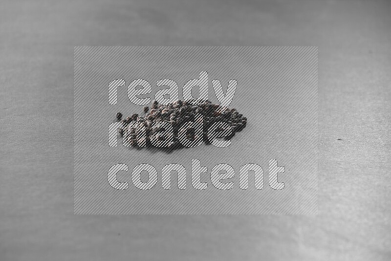 Black pepper on a black flooring