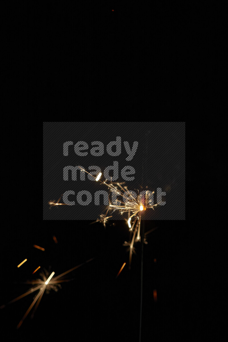 A close-up image of sparkler candle isolated on black background
