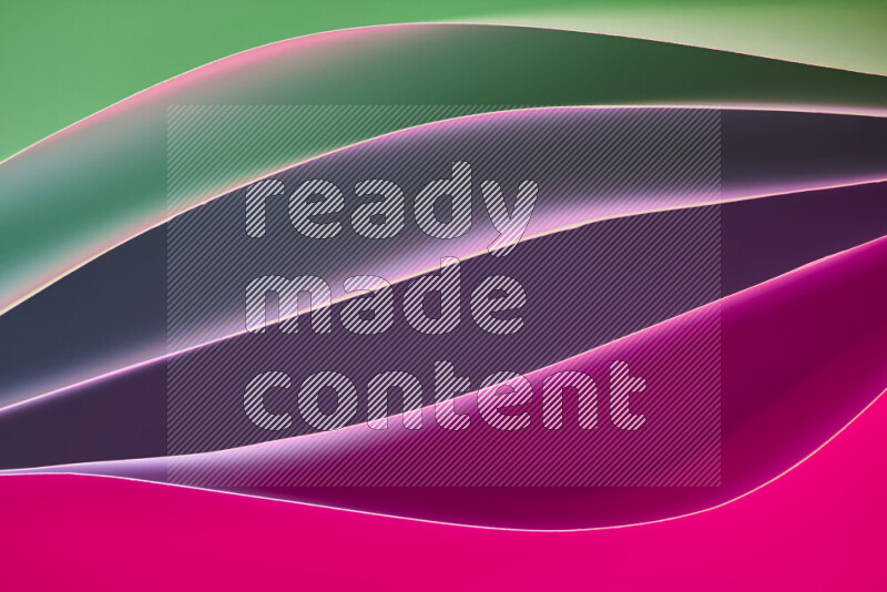 This image showcases an abstract paper art composition with paper curves in green and pink gradients created by colored light