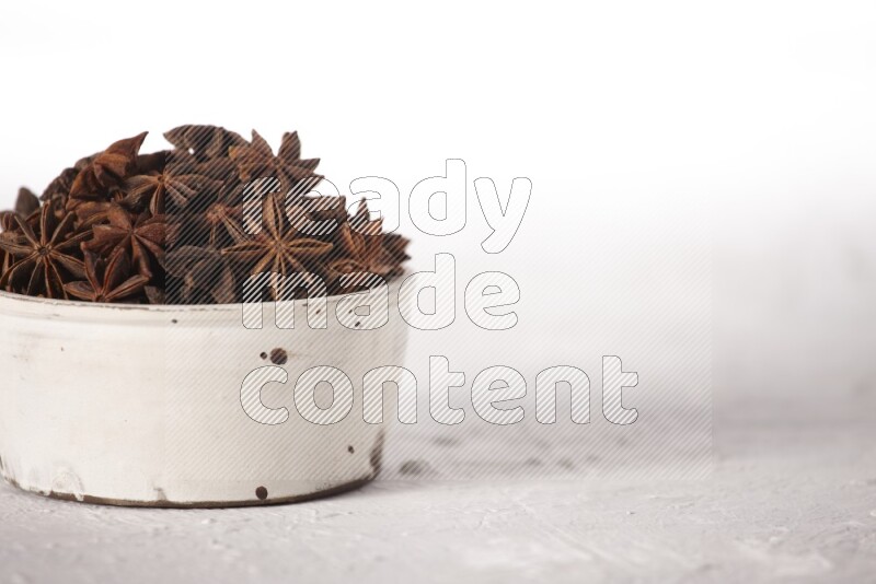Star Anise in a white bowl on white background