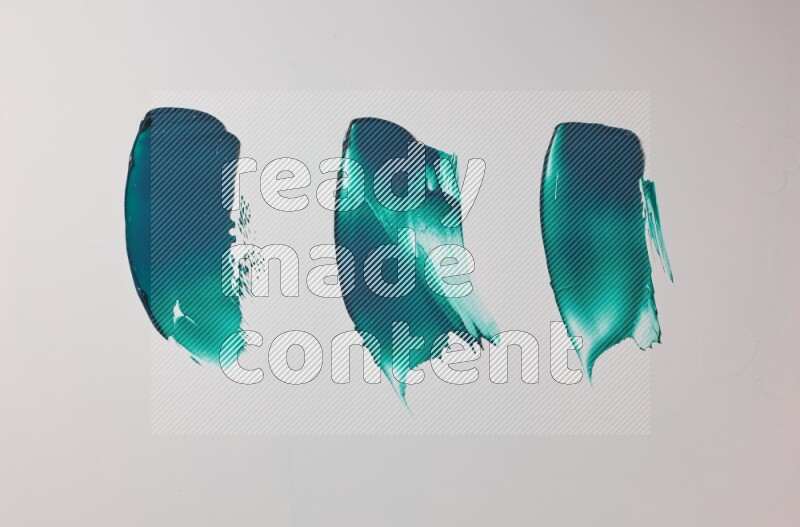 Turquoise painting knife strokes on white background