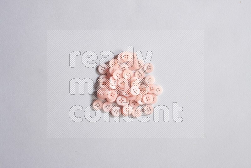 Rose buttons placed on grey background