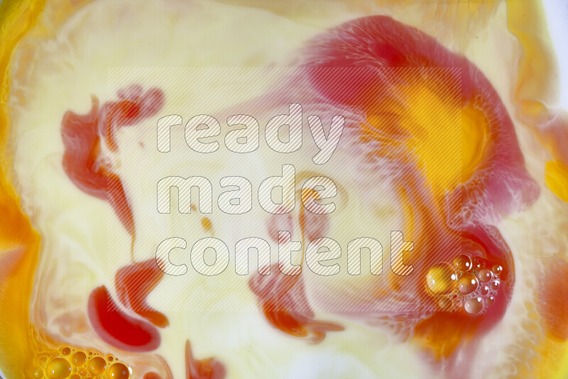 A close-up of abstract swirling patterns in orange, red and white