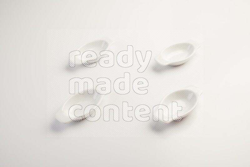 white ceramic oval sauce dish on white countertop