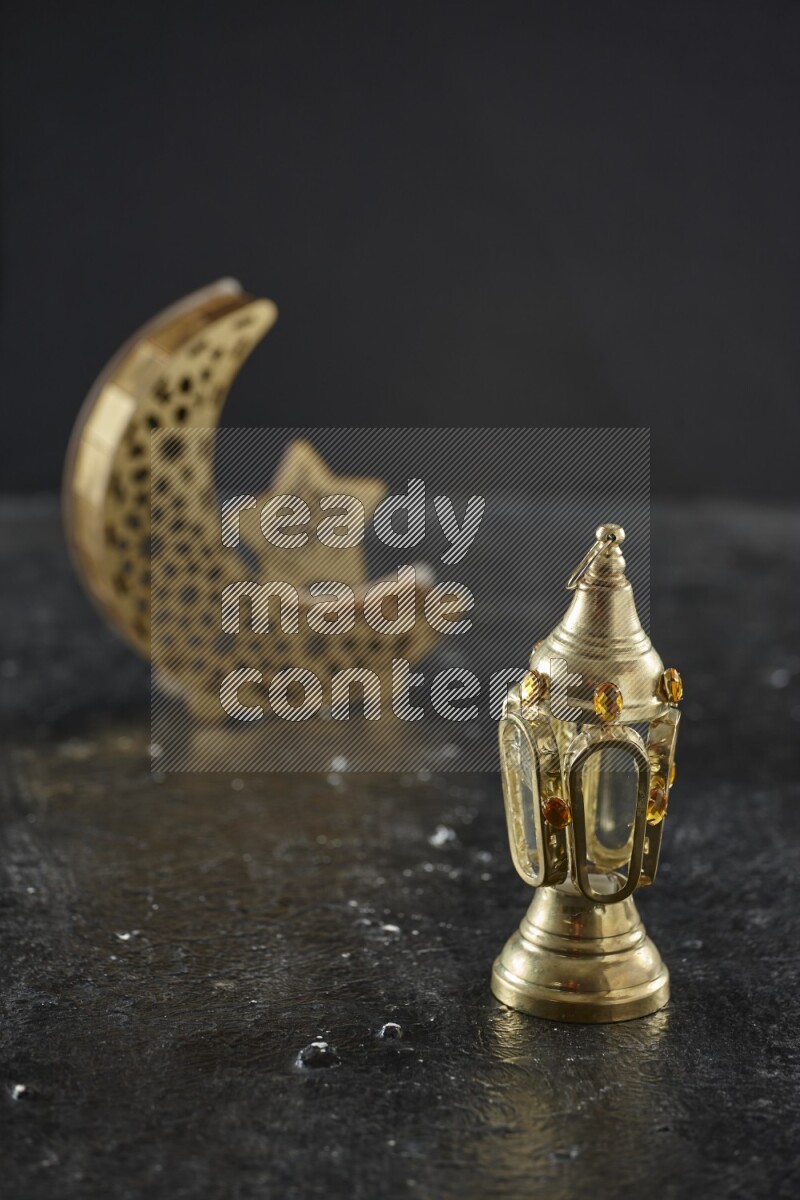 A crescent lantern with classic lantern on textured black background