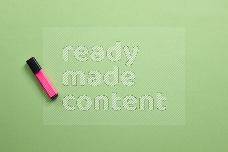 Multicolored highlighter pens on green background