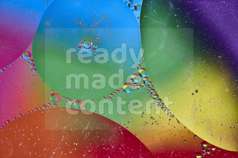 Close-ups of abstract oil bubbles on water surface in multicolors