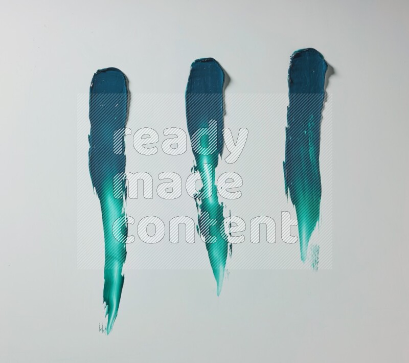 Turquoise painting knife strokes on white background