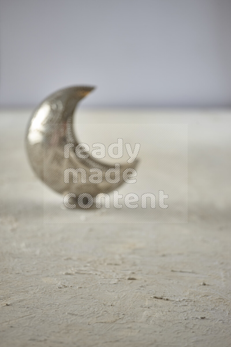A lantern placed on a textured white background