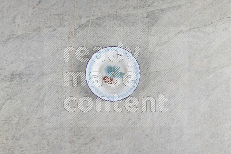 A vintage metal plate on grey marble background