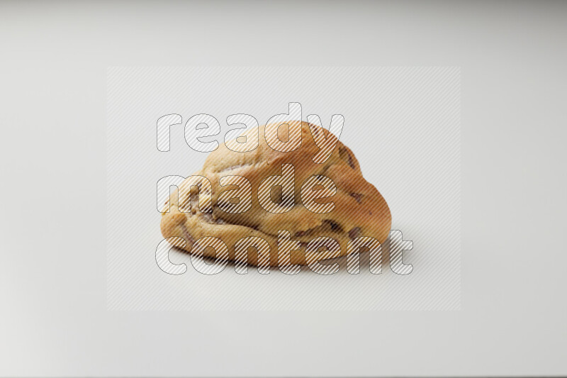 a chocolate chip cookie on a white background