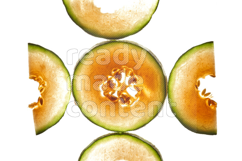 Cantaloupe slices on illuminated white background