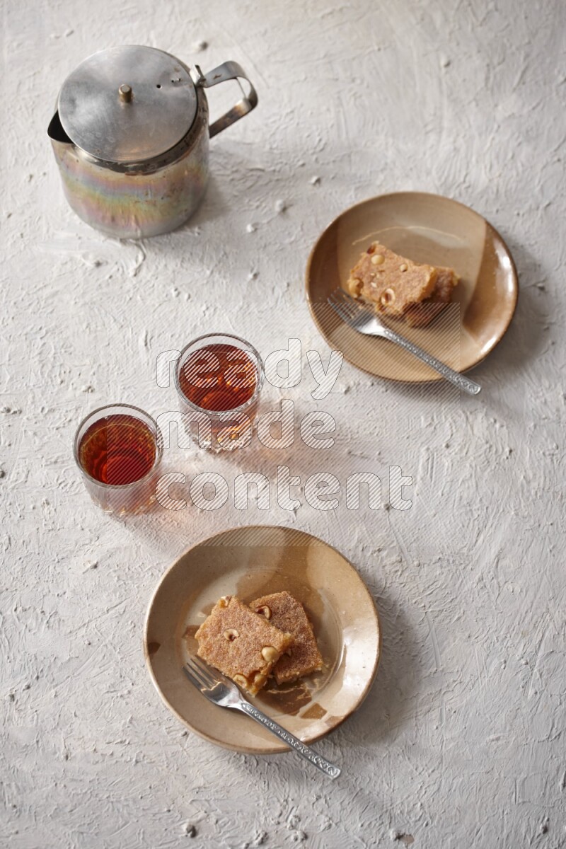 Basbousa with tea in a light setup