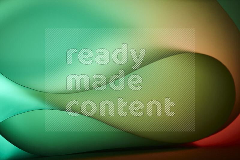 فن تجريدي يعرض منحنيات وتدرجات اللون الأخضر والبرتقالي مكونه بضوء ملون