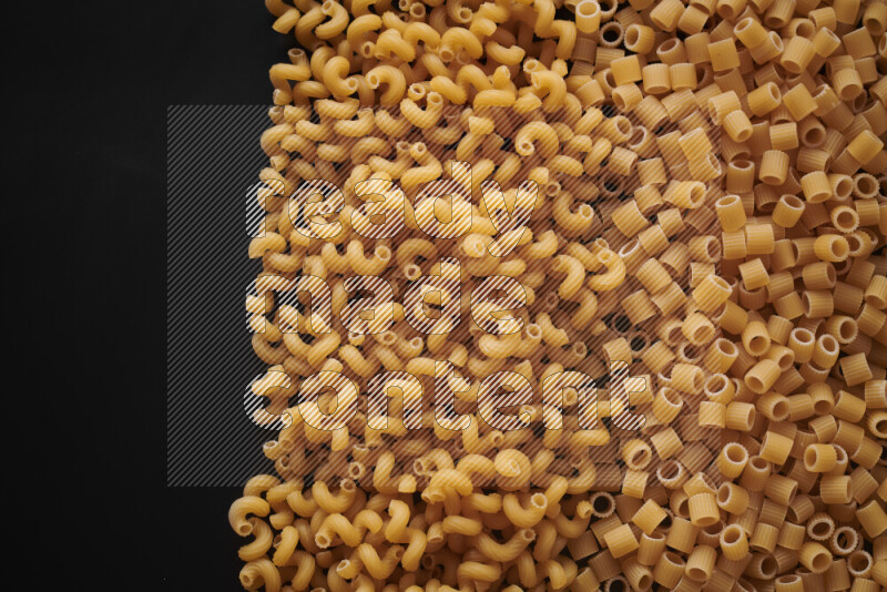 Different pasta types on black background