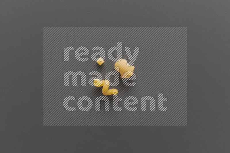 Different pasta types on grey background