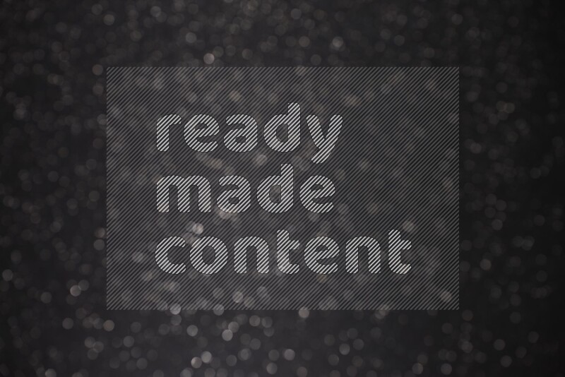 Black glittery bokeh background