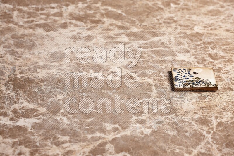 A decorative coaster on beige marble background