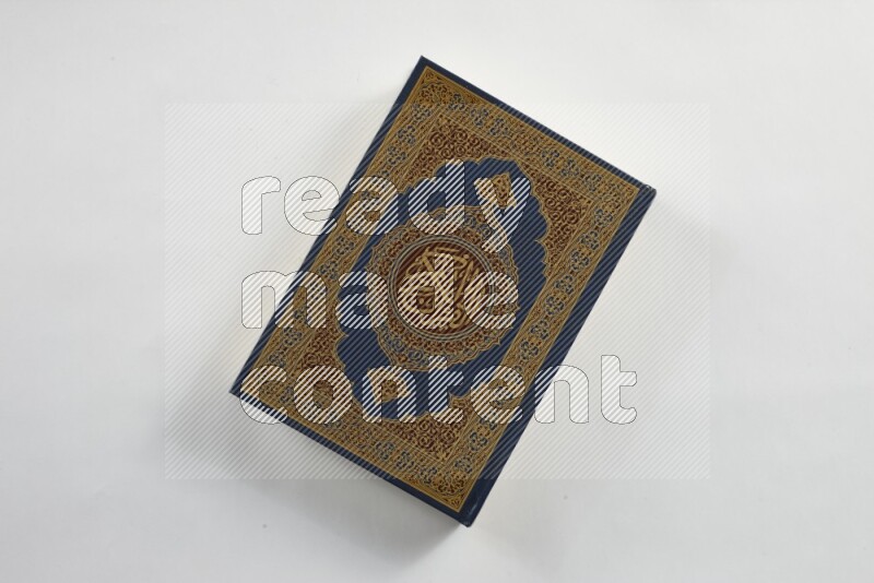 Quran with a prayer beads on white background