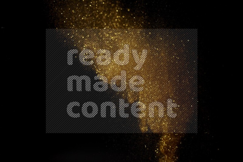 Gold glitter powder isolated on black background