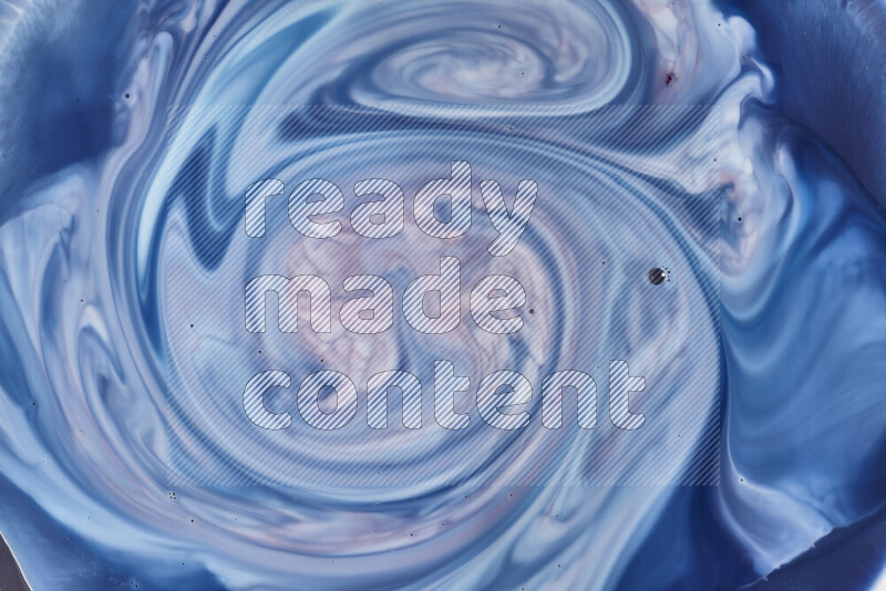 لقطة مقربة لأنماط دوامية باللون الأزرق والأحمر والأبيض