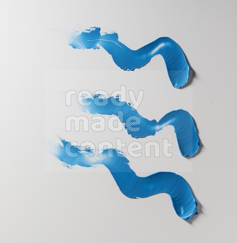 Blue zigzag painting knife strokes on white background
