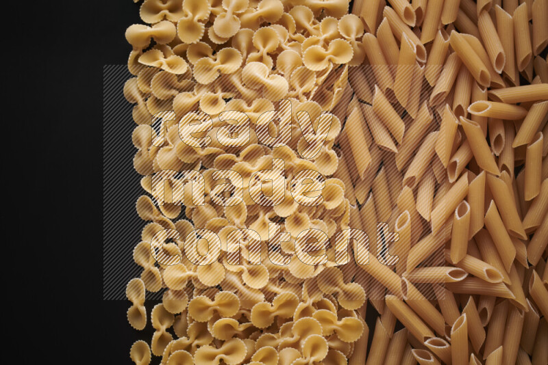 Different pasta types on black background