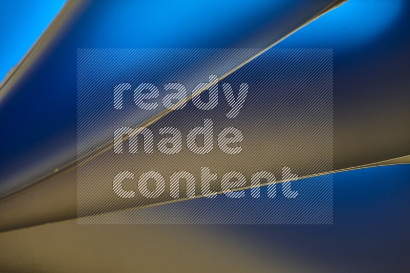 An abstract art piece displaying smooth curves in warm and cold gradients created by colored light