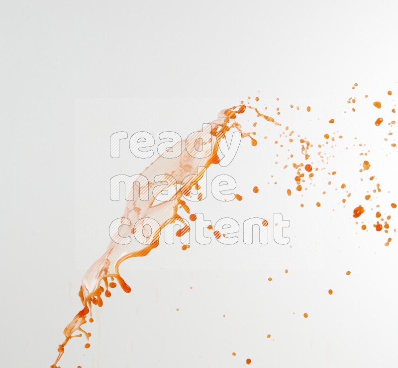 Orange liquid splash and drops on white background