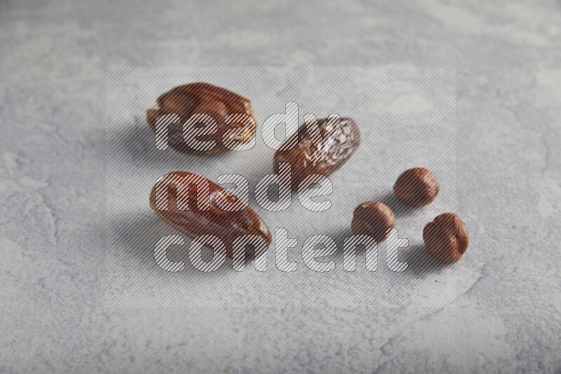 Hazulnut stuffed date on light grey background