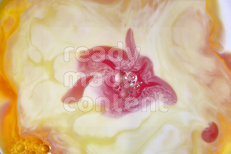 A close-up of abstract swirling patterns in orange, red and white