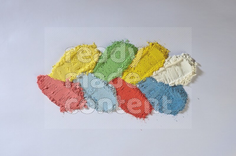 Multicolored powder smears on white background