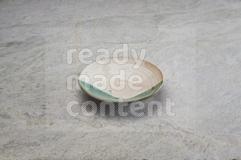 Decorative Pottery Plate On Grey Marble Flooring