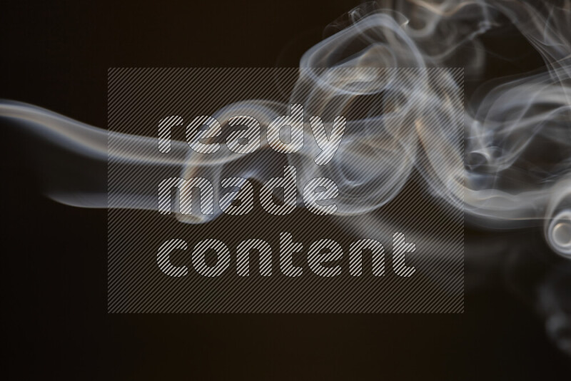 Motion of wavy smoke isolated on dark background