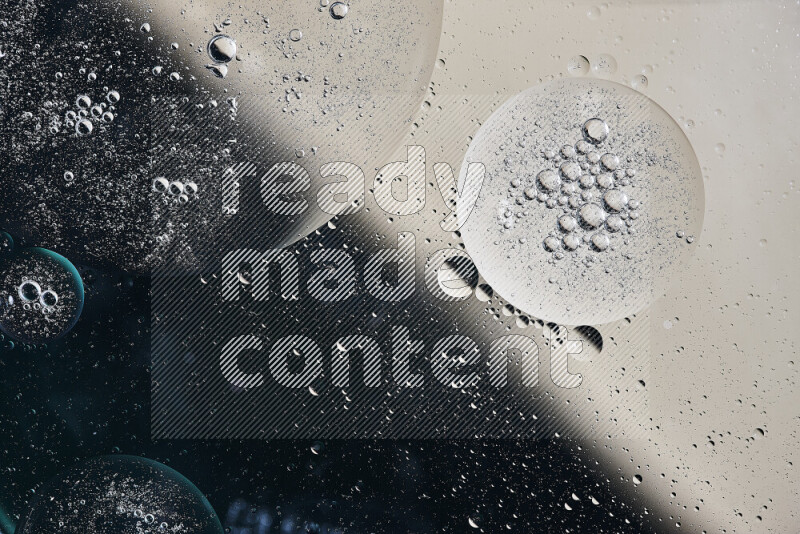 Close-ups of abstract oil bubbles on water surface in shades of green and brown