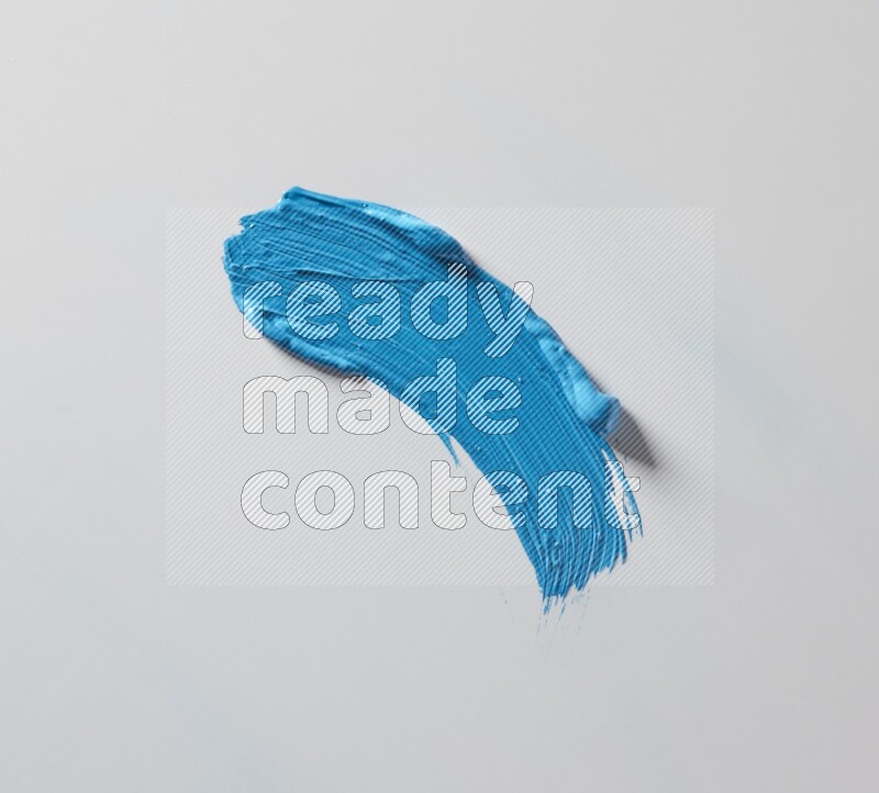 A single blue curved brush stroke on a white background