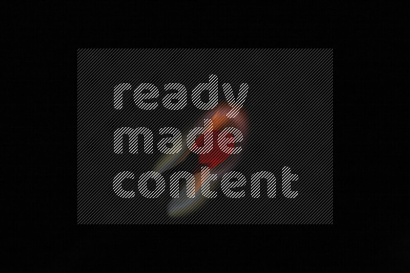 A burning matchstick isolated on dark backdrop