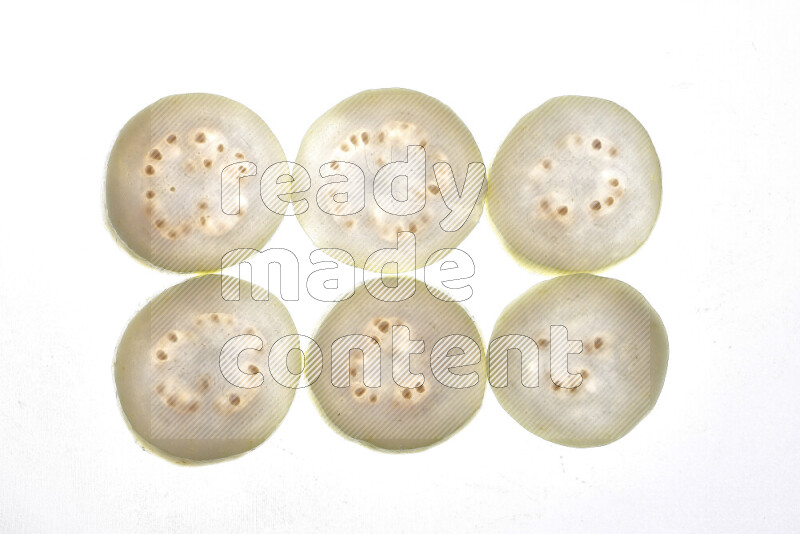 Guava slices on illuminated white background