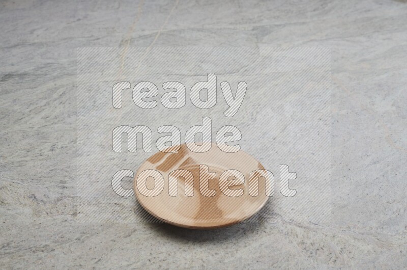 Multicolored Pottery Plate On Grey Marble Flooring