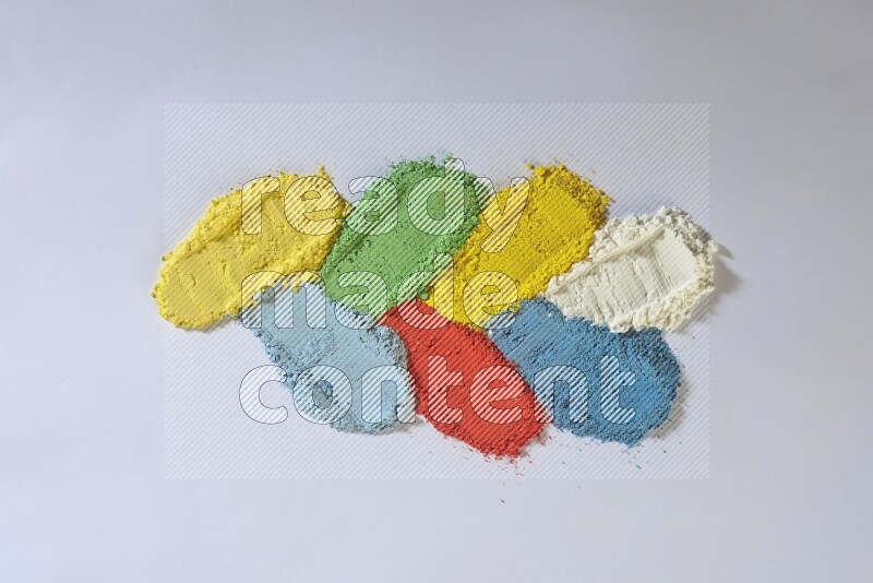 Multicolored powder smears on white background