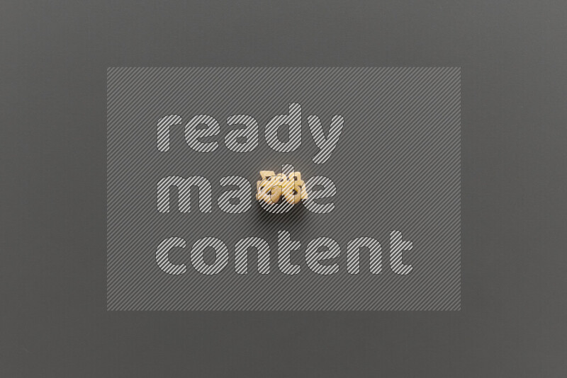 Shaped children pasta on grey background