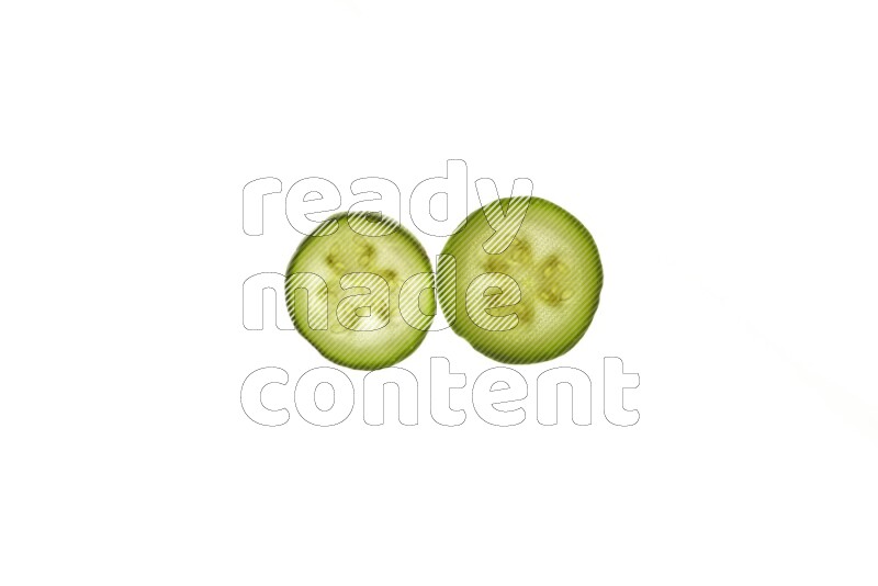 Zucchini slices on illuminated white background