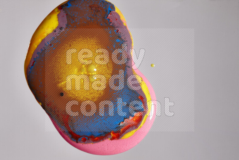 Close-ups of assorted colors blending on a grey background