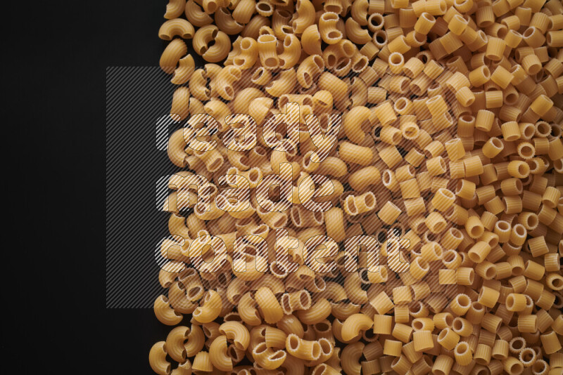 Different pasta types on black background