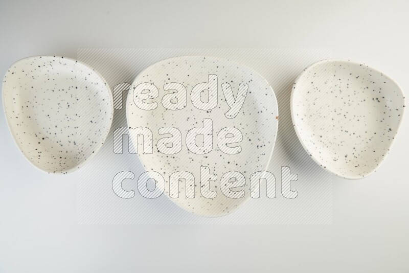 white plate with black dots on white background