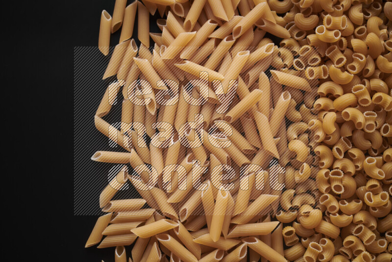 Different pasta types on black background