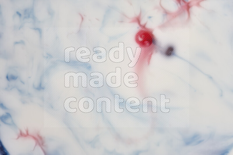 A close-up of abstract swirling patterns in blue, red and white