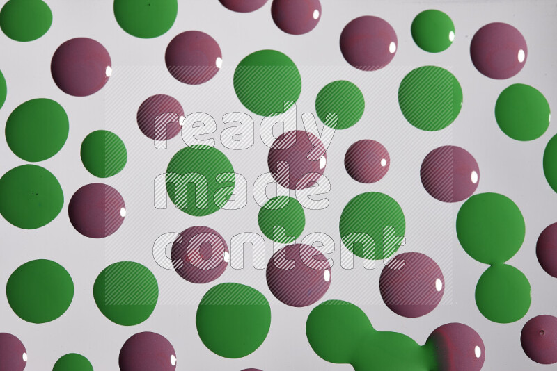 Close-ups of abstract purple and green paint droplets on the surface
