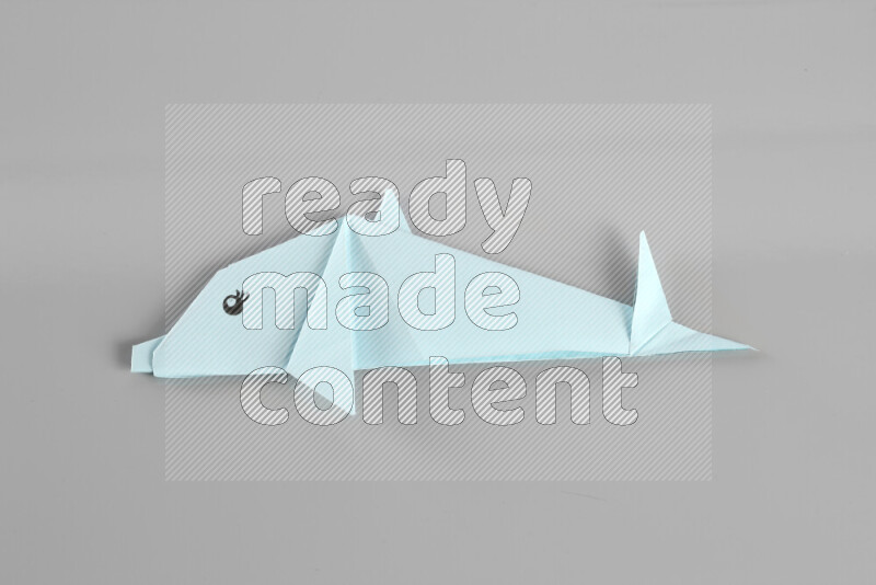 Origami animals on grey background