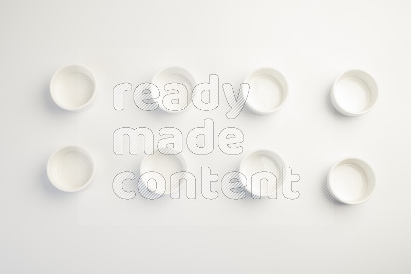 white ceramic round sauce dish on white countertop